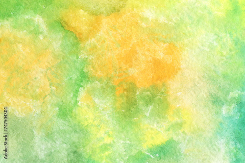 Bright multicolored watercolor texture. Abstract hand-drawn background in green and yellow colors.