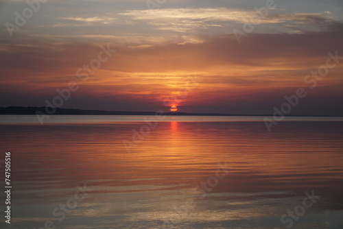 sunset at the beach. sunset in the sea. sunset over the sea.  © Oksana
