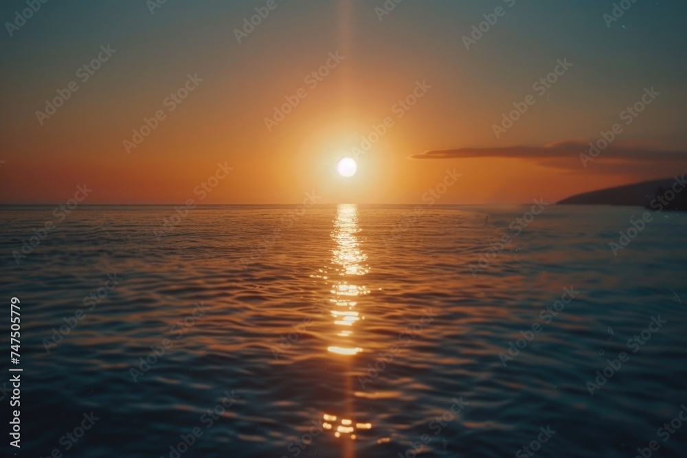 A beautiful sunset over the calm ocean. Perfect for travel and relaxation concepts