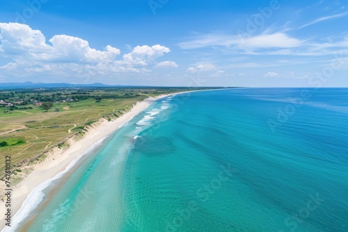 A stunning aerial view of a beach and ocean. Perfect for travel websites or tourism brochures © Fotograf