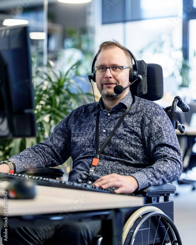 A person with a motor disability working in an inclusive workplace photo