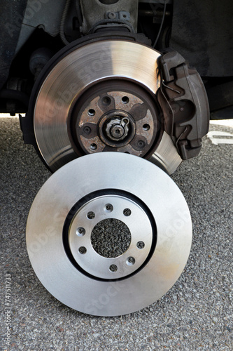 Maintenance of a braking system of a car, with the change of a worn brake disc with a new brake disc. This is an important safety element on a car.