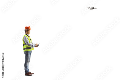 Engineer in a safety vest flying a drone