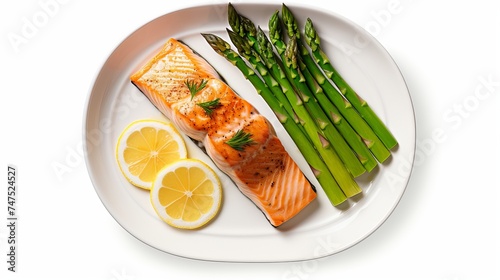Salmon with steamed asparagus isolated top view