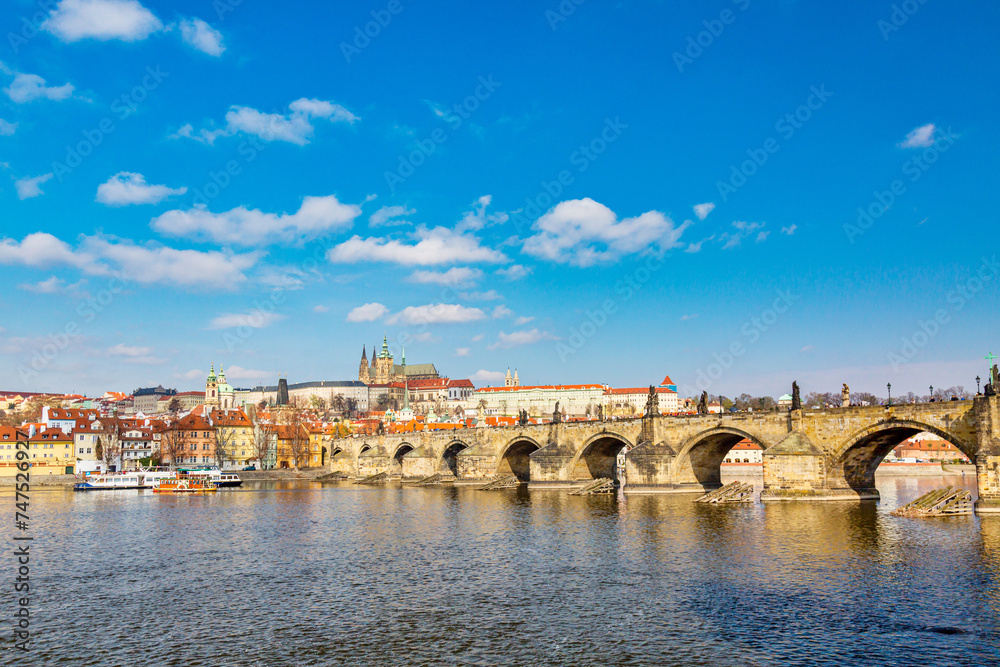 View of Charles Bridge, Prague Castle and Vltava river in Prague, Czech Republic during summer spring day