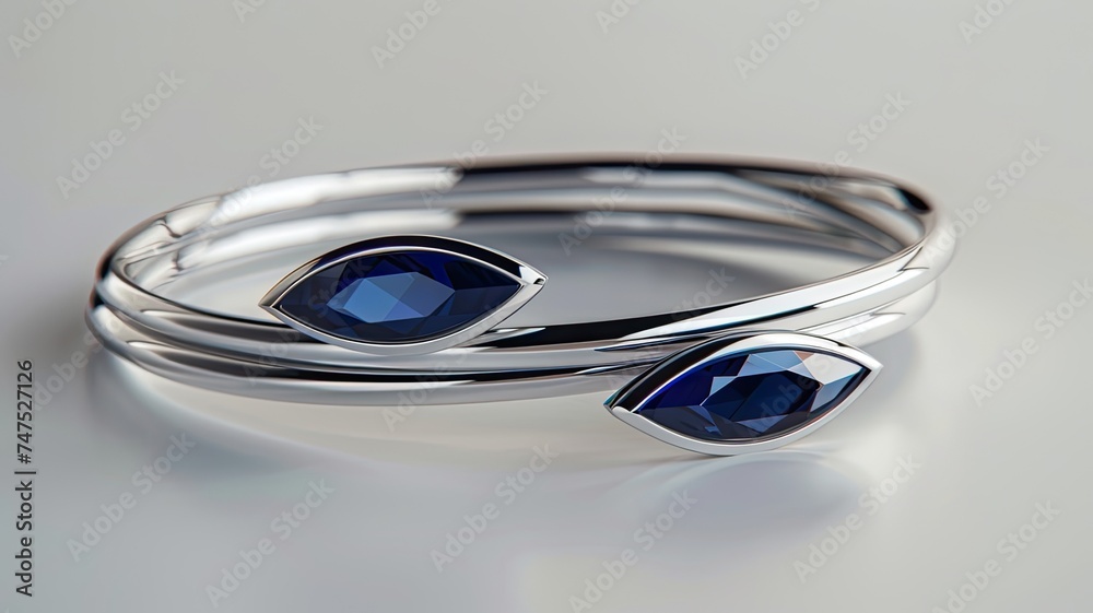 a delicate Indian bangles set adorned with two marquise-cut blue sapphires, elegantly set in 14k white gold, capturing the beauty and intricacy of the gemstone jewelry.