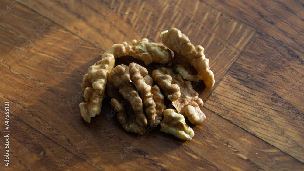 Fototapeta premium Walnut close-up. Walnut on a wooden table