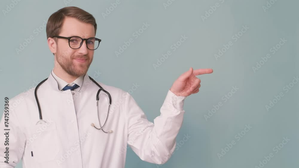 Male doctor with glasses, dress shirt, smile, and stethoscope Male doctor with glasses, dress shirt, smile, and stethoscope
