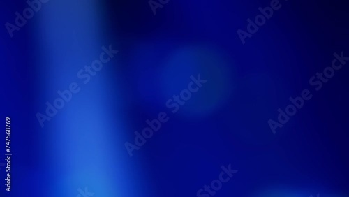 Abstract blurred background with fast moving green and blue lights, flashing like at a music concert. Real time video.