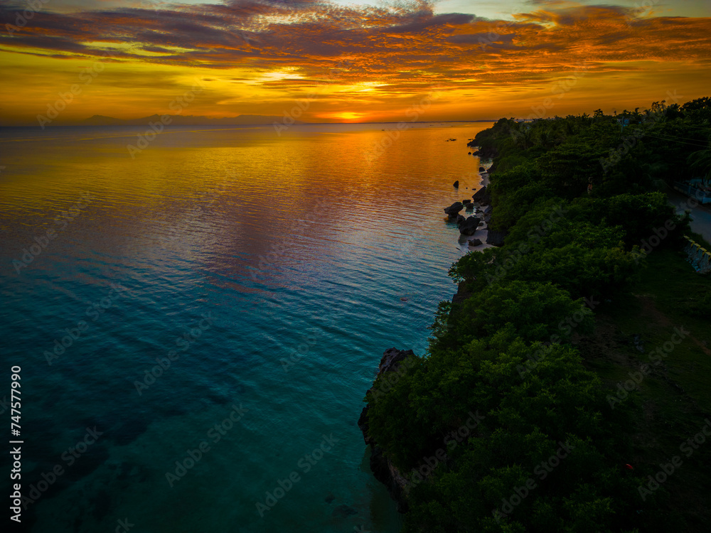 Sunset Glow over the Rocky Coastline of Bantayan Island, Philippines
