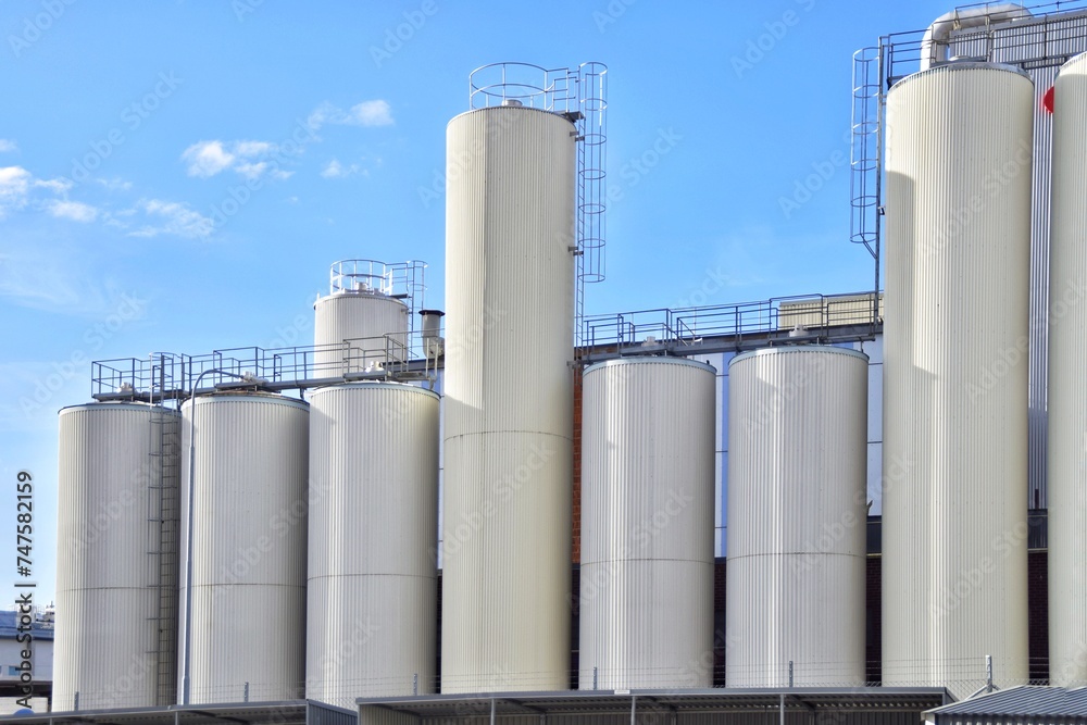 White tanks of a modern dairy plant.