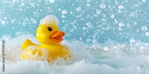 Yellow rubber duck toy floating on a bubble bath tub, top view, copy space, summer vacation, relaxation, bubble bath.
