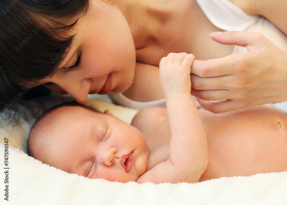 Happy mother and infant sweet sleeping lying on white bed Happy mother and infant sweet sleeping lying on white bed