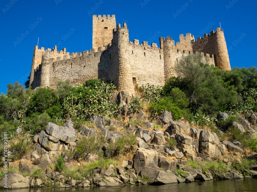 Looking up to Almorol Castle atop the rock island in Tagus River