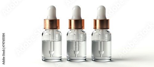 Three glass dropper bottles with gold caps arranged neatly on a white surface, creating a clean and modern aesthetic.