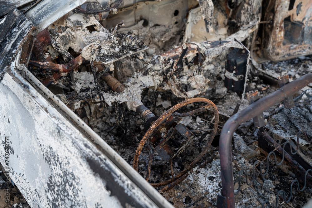 A burned out car. Burnt car in the field. Car fire, vehicle fire due to short circuit. Stolen car intentional arson. One vehicle was damaged in the fire. A burned out car. Burnt car in the field. Car fire, vehicle fire due to short circuit. Stolen car intentional arson. One vehicle was damaged in the fire.