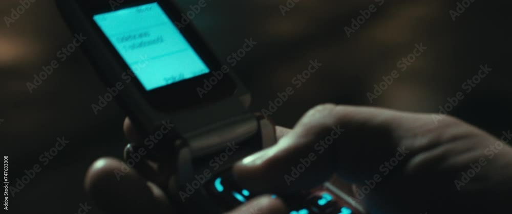 A man receives a message on the vintage mobile phone