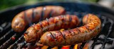 Two juicy sausages sizzle on a homemade grill, imparting a delectable flavor during the vibrant spring season.