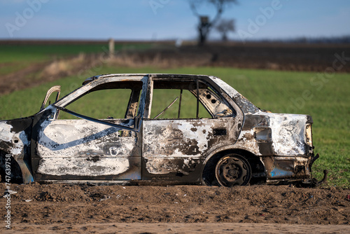 A burned out car. Burnt car in the field. Car fire, vehicle fire due to short circuit. Stolen car intentional arson. One vehicle was damaged in the fire.
