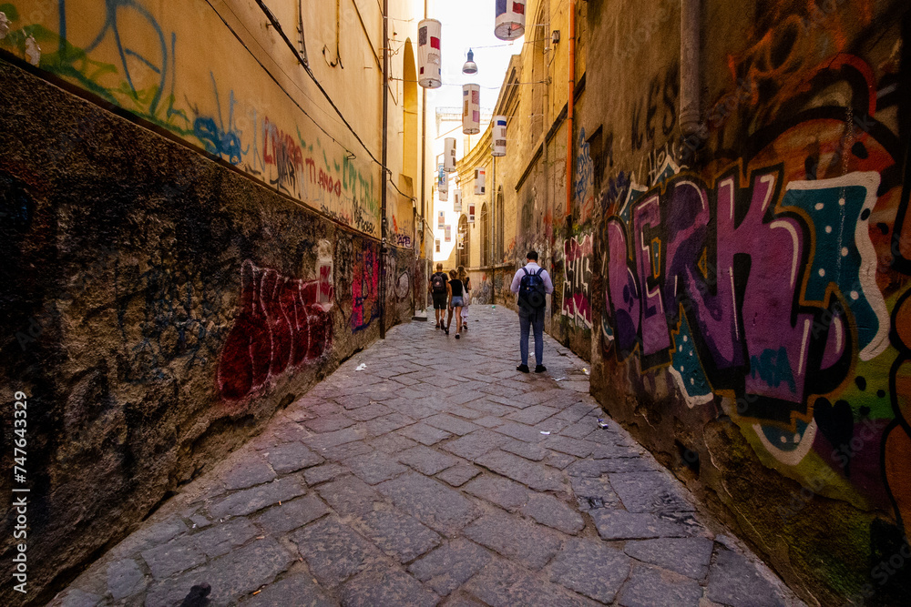 Fototapeta premium Naples, Italy The famous city of the italian south with Largo Maradona, Plebiscito Square, the gallery, Quartieri Spagnoli Spaccanapoli Vomero and the lagoon. Murales all over the town