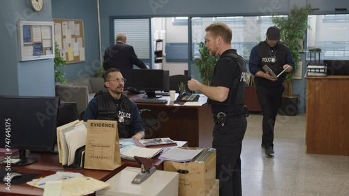 Busy police scene in a precinct full of detectives