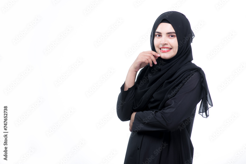 Muslim, A beautiful Asian Muslim woman is smiling, on isolate white background, with copy space. Muslim, A beautiful Asian Muslim woman is smiling, on isolate white background, with copy space.