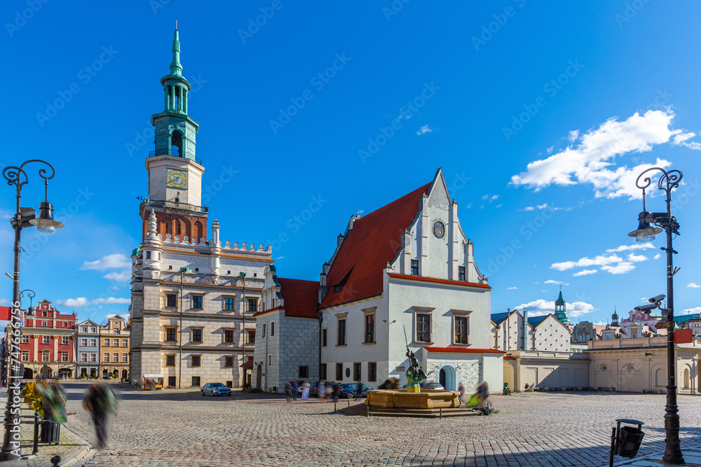 View of historic building of Weighing house and Town Hall in centre of Poznan Market Square in sunny spring day, Poland