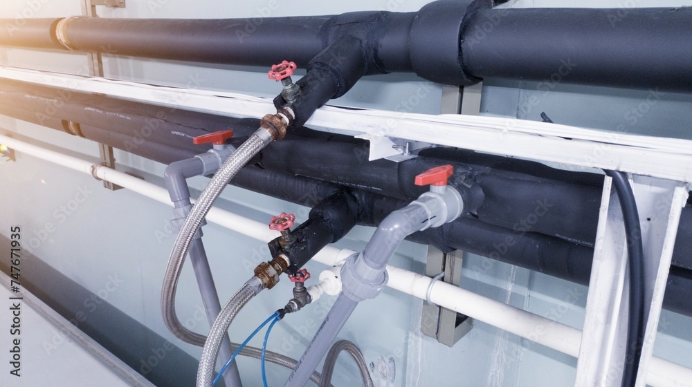 Installation of water chiller pipes with insulation and supply water on the stop gate valve. Installation of water chiller pipes with insulation and supply water on the stop gate valve.