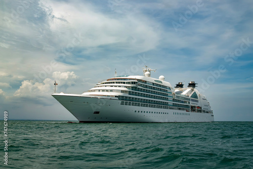 Cruise Ship Sailing on the Ocean with Cloudy Sky © Bangmunce