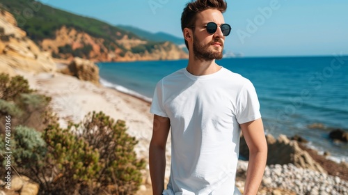 white blank mockup of a t-shirt bella - canvas 3001 with male model  beach background 