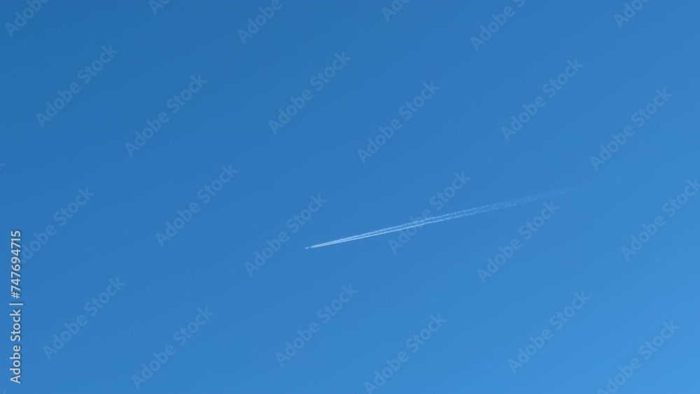 Flying commercial airplanes over sunny blue sky Flying commercial airplanes over sunny blue sky
