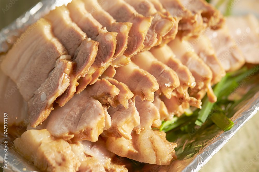 Boiled pork on a plate, Korean food Boiled pork on a plate, Korean food