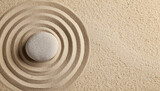 Zen rock garden. Circle patterns on beige sand, top view; space for text
