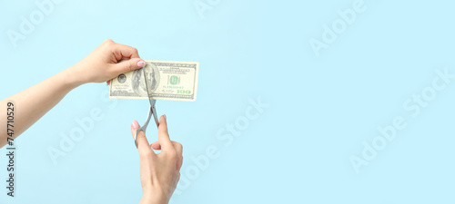 Woman cutting dollar bankno...