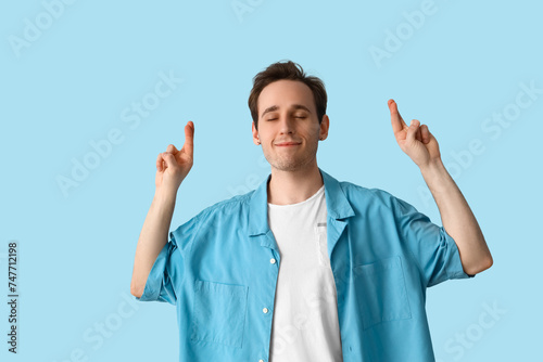 Young man pointing at somet...