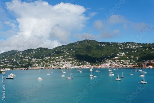 The view of the private yachts and boats on the bay overlooking the town near St Thomas
