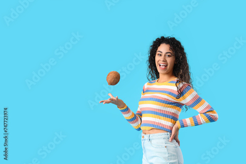 Happy young woman with curl...