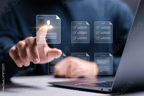 Wallpaper Mural Businessman checking cv resume on virtual screen for human resources management concept. Recruitment process to work efficiently and achieve sustainable business success. team building. Torontodigital.ca