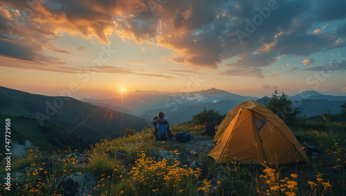 Tourist tents atop a mountain with a beautiful view of nature at sunrise, enjoy camping on the weekends photo