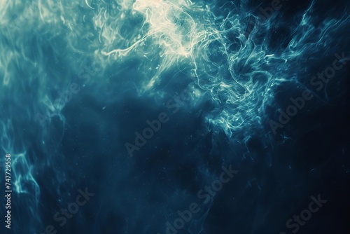 Abstract background with dark blue hues and subtle glowing particles for a mystical feel © Bijac
