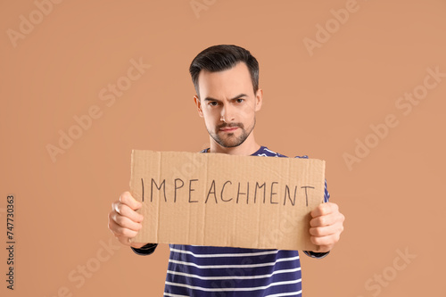 Protesting young man holdin...