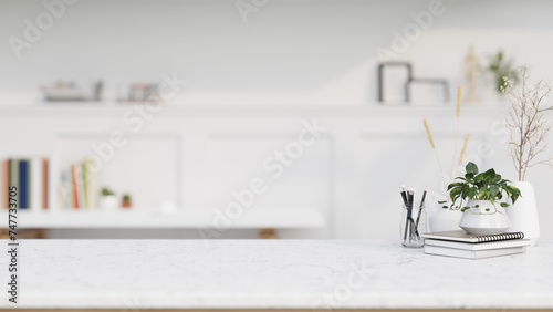 Fototapeta Naklejka Na Ścianę i Meble -  A copy space for display product on a white marble tabletop in a contemporary white home office.