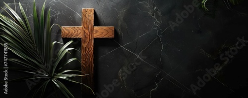 Easter wooden cross on black marble background religion abstract palm sunday concept photo
