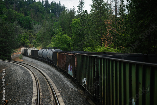 Canvastavla A long train with a mixed manifest of boxcars and tankcars, showing freight of goods such as fossil fuels and phosphate