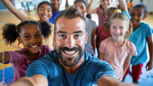 Happy PE teacher and school kids taking selfie during exercise class