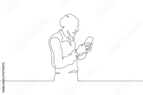 A old man stands with a phone in his hand. A old man is talking on a smartphone. One continuous line . Line art. Minimal single line.White background. One line drawing.