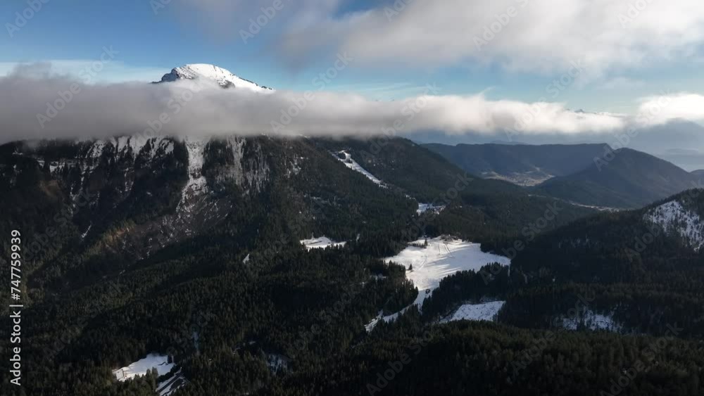Misty mountain with snow and large cloud in front of the summit, Chamrousse Misty mountain with snow and large cloud in front of the summit, Chamrousse