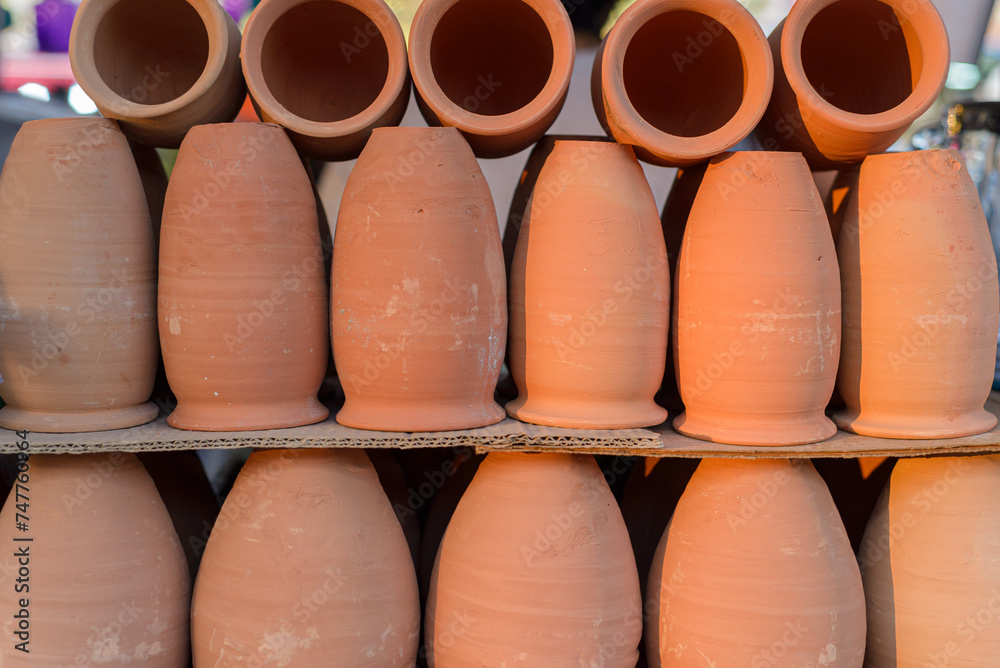 Cantaritos of clay in the foreground. Typical vessels from Mexico. Cantaritos of clay in the foreground. Typical vessels from Mexico.