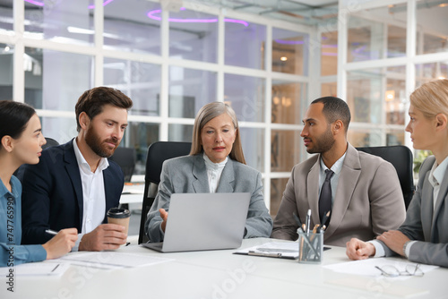 Lawyers working together at table in office