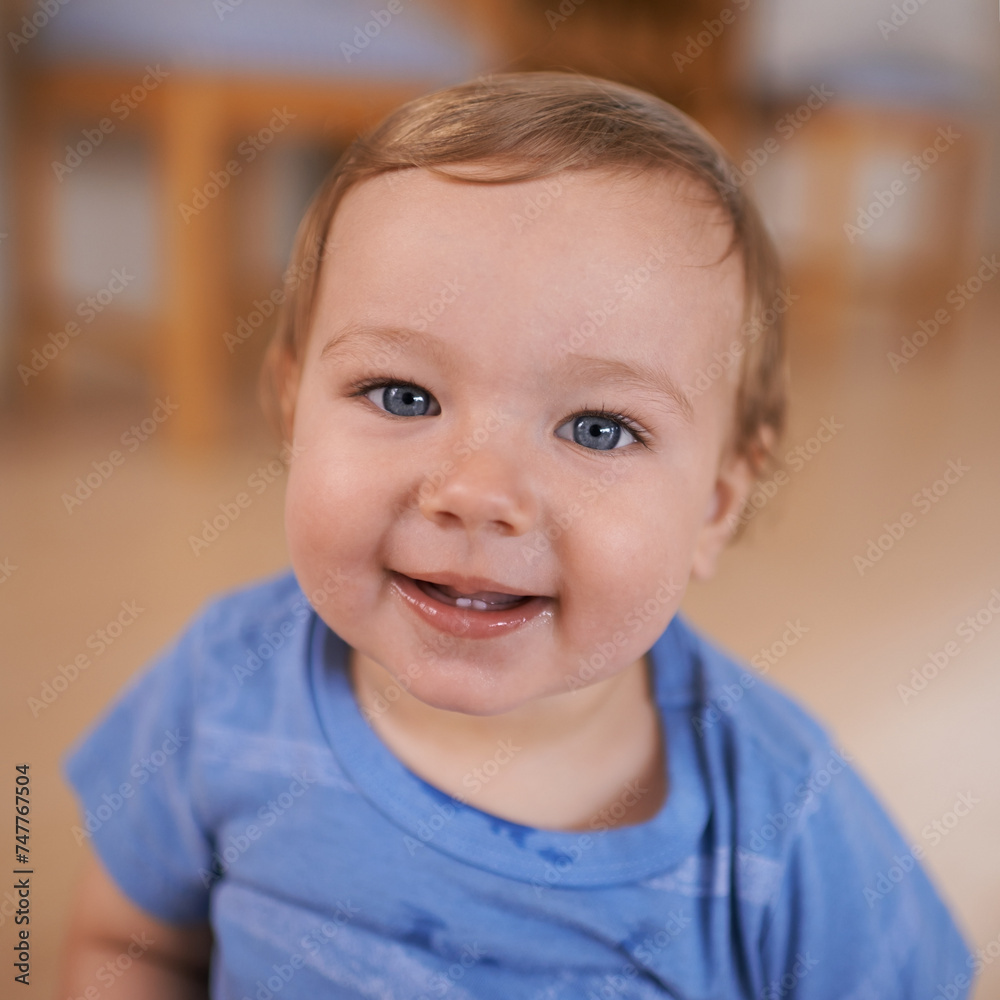Toddler, smile and portrait of baby in home for fun playing, happiness or learning in living room. Relax, healthy boy or face of a male kid on floor for child development or growth in a house alone